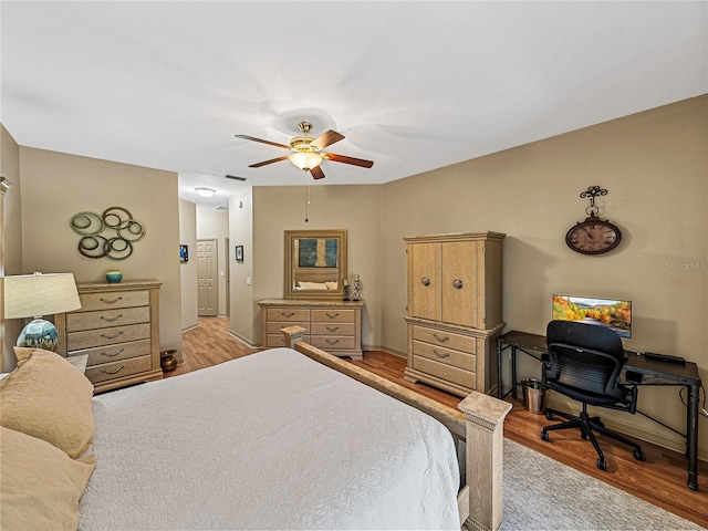 bedroom featuring ceiling fan and light hardwood / wood-style floors