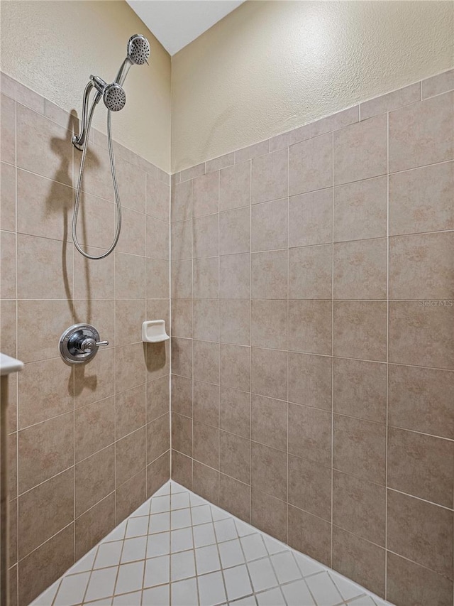 bathroom with tiled shower