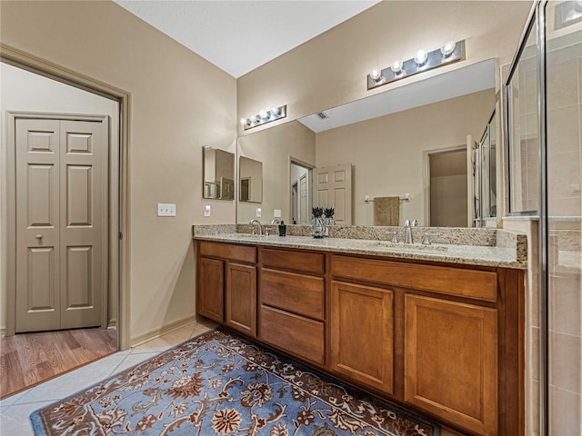 bathroom with vanity and hardwood / wood-style flooring