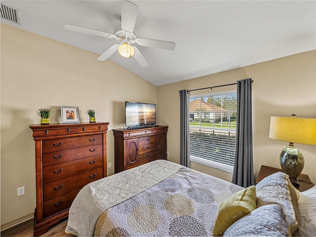 bedroom with wood-type flooring, ceiling fan, and lofted ceiling