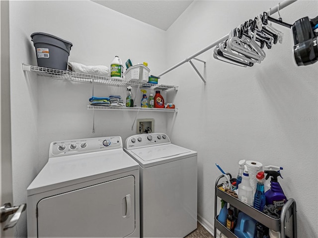 clothes washing area featuring washer and clothes dryer