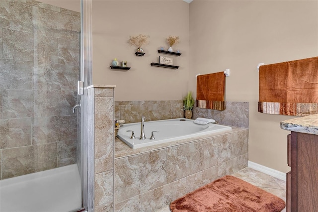 bathroom with tile patterned flooring, vanity, and plus walk in shower