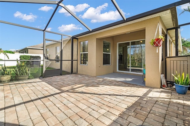 view of patio / terrace featuring a lanai