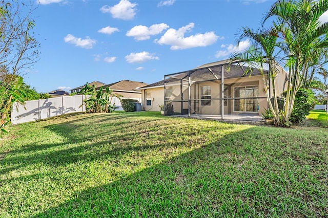 view of yard featuring a lanai and a patio area