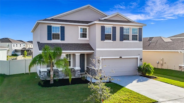 front facade with a front yard and a garage