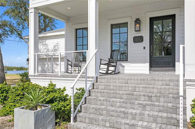 doorway to property featuring covered porch