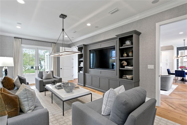 living room featuring french doors, crown molding, and light parquet flooring