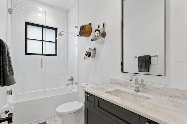 full bathroom featuring toilet, vanity, tile patterned floors, and tiled shower / bath combo