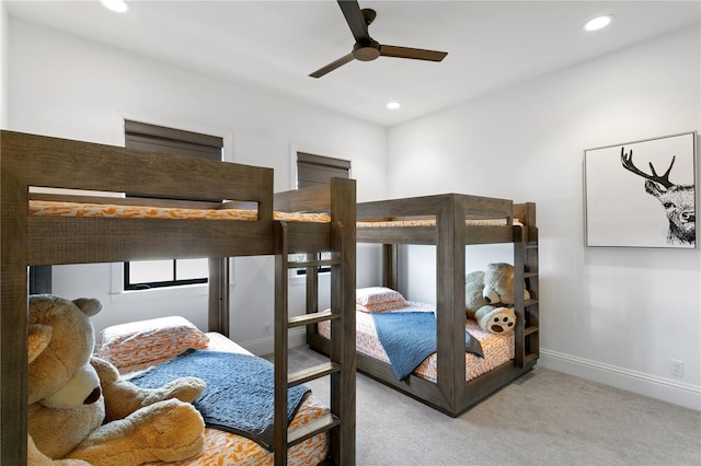 bedroom with ceiling fan and light colored carpet