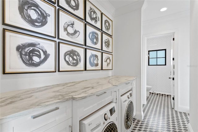 washroom featuring tile patterned flooring, crown molding, and washer / clothes dryer