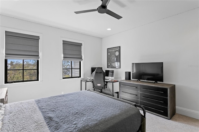 bedroom featuring ceiling fan and light colored carpet