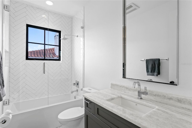 full bathroom featuring vanity, toilet, and tiled shower / bath