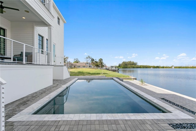 view of pool featuring a water view, ceiling fan, and a patio area