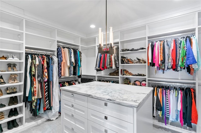 spacious closet with light carpet