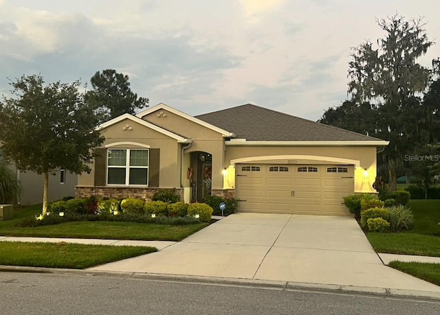 view of front of house featuring a front yard and a garage