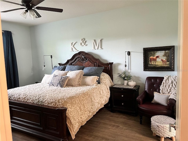 bedroom featuring ceiling fan and dark wood-type flooring