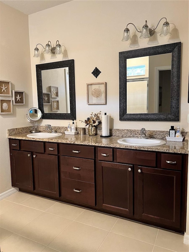 bathroom with tile patterned floors and vanity