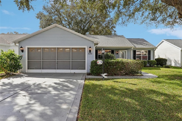 single story home with a garage and a front lawn