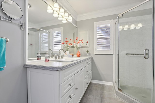 bathroom with tile patterned floors, vanity, crown molding, and walk in shower