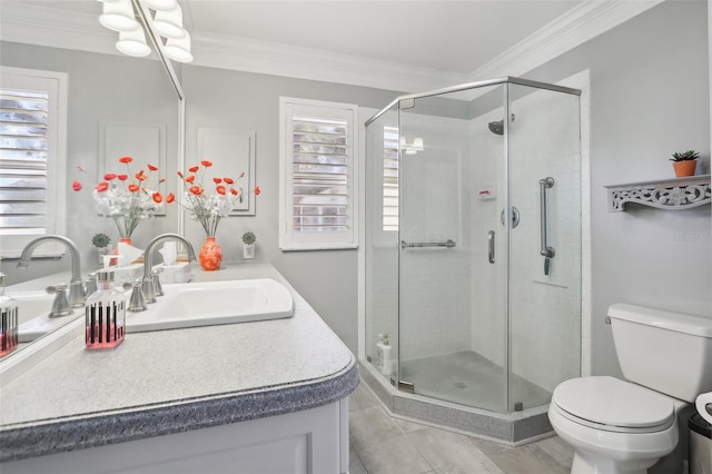 bathroom featuring an enclosed shower, vanity, toilet, and ornamental molding