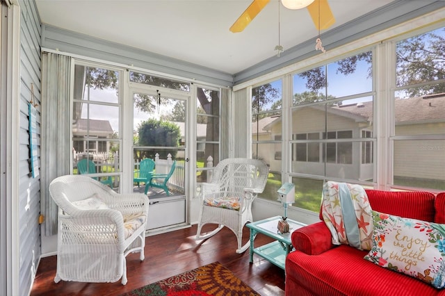 sunroom / solarium with ceiling fan