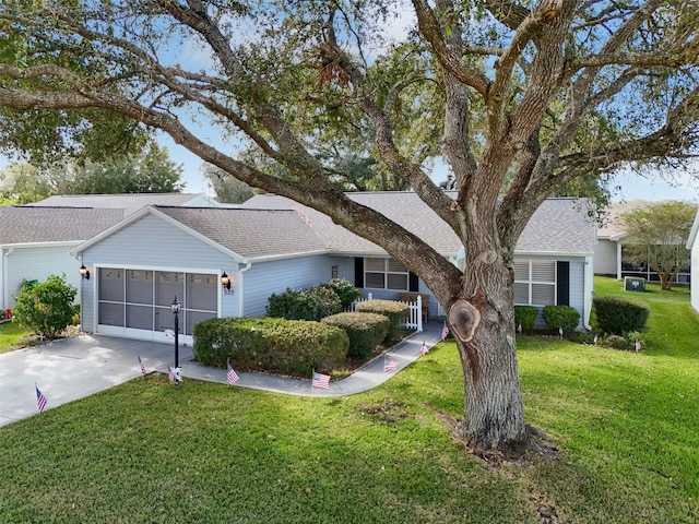 ranch-style house with a front yard and a garage