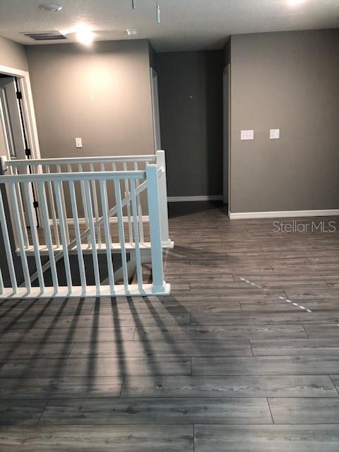 empty room featuring hardwood / wood-style flooring