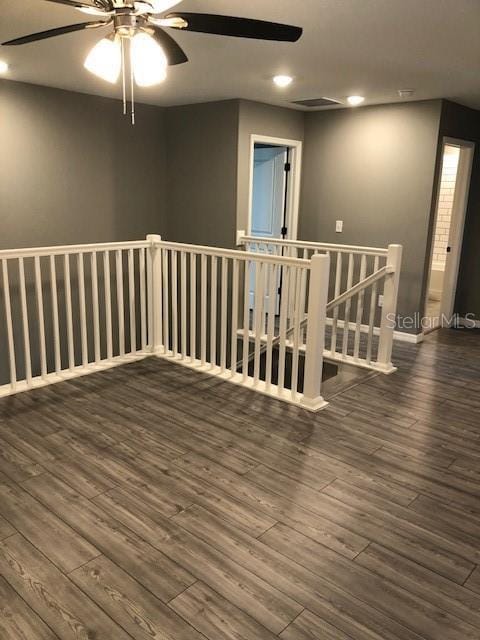 empty room with dark wood-type flooring