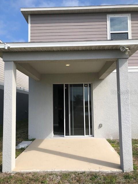 back of house featuring a patio