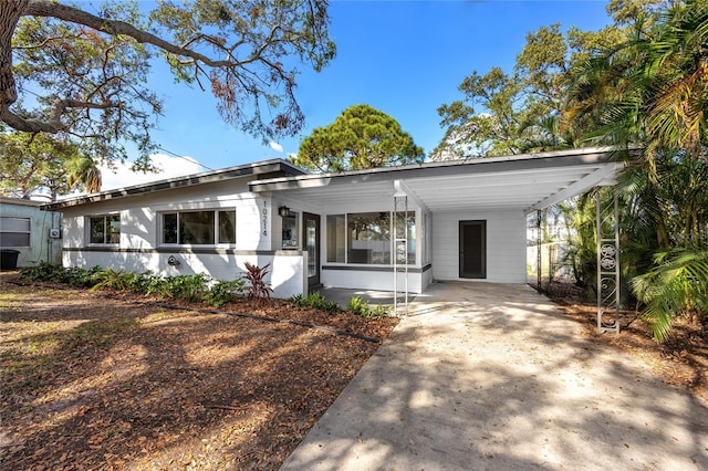 view of front of property featuring a carport