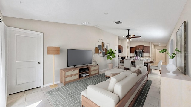 living area with lofted ceiling, ceiling fan, light tile patterned floors, visible vents, and baseboards