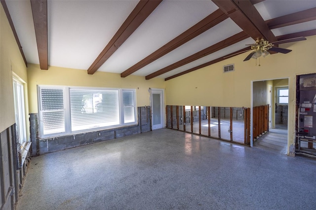 spare room with ceiling fan and beamed ceiling