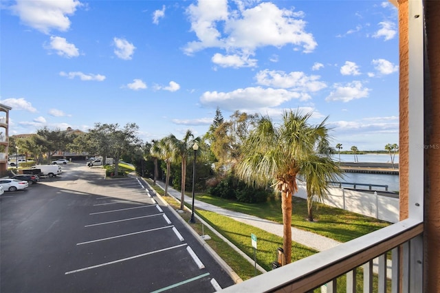 view of vehicle parking featuring a water view