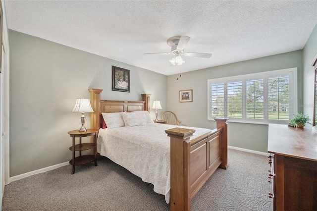 bedroom with light carpet, ceiling fan, a textured ceiling, and baseboards