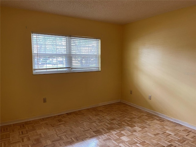 820 Virginia St Unit 207, Dunedin, FL 34698 - empty room with a textured ceiling and baseboards