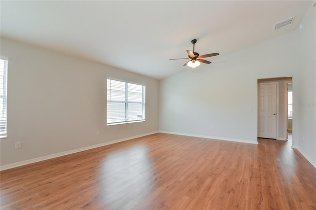 unfurnished room with light hardwood / wood-style floors, lofted ceiling, and ceiling fan