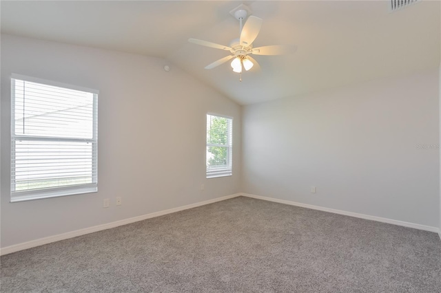 unfurnished room featuring lofted ceiling, ceiling fan, and carpet floors