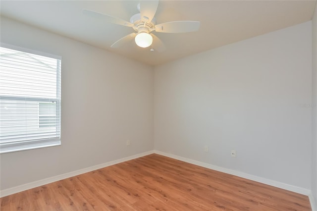 spare room featuring ceiling fan and wood-type flooring