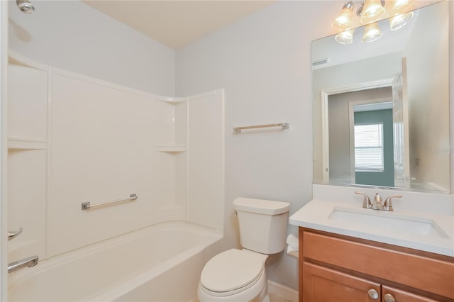 full bathroom with toilet, vanity, and shower / washtub combination