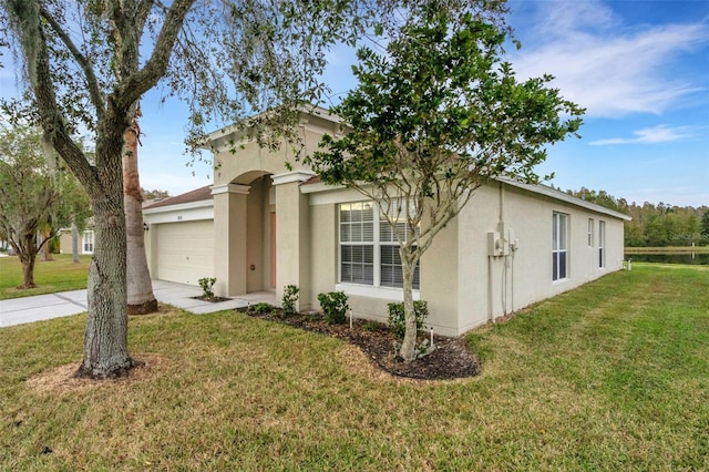 view of front of property with a garage and a front yard