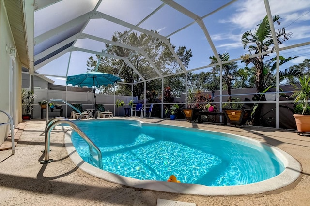 view of pool featuring a lanai and a patio