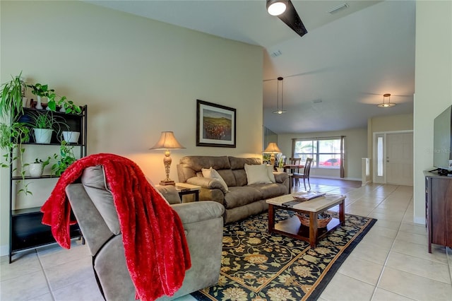 living room featuring light tile patterned floors and high vaulted ceiling