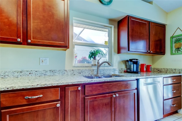 kitchen featuring dishwasher, light stone countertops, and sink