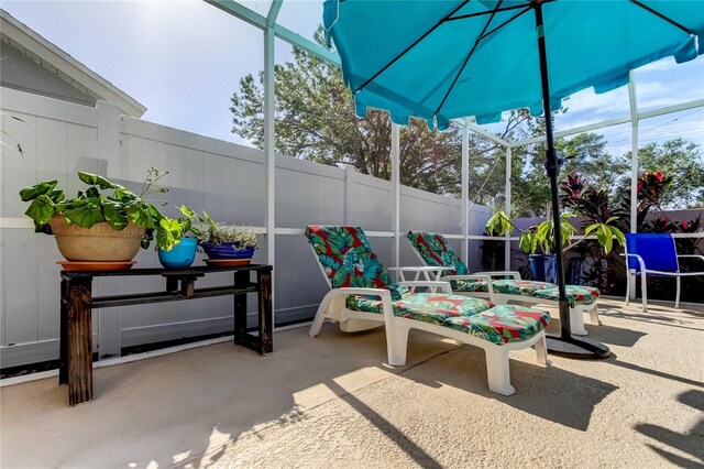 view of patio / terrace with a lanai