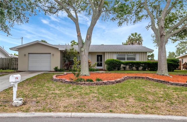 ranch-style home with a garage and a front lawn