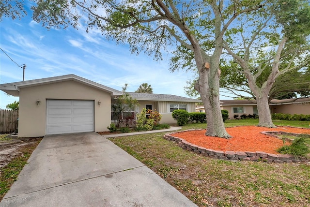 single story home with a front lawn and a garage