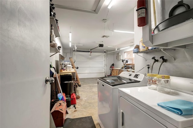 washroom with washing machine and clothes dryer