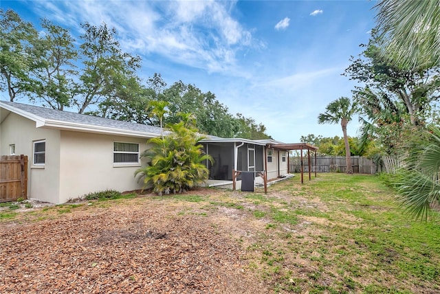 view of yard featuring a sunroom