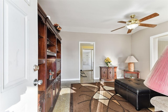 living room with dark colored carpet and ceiling fan