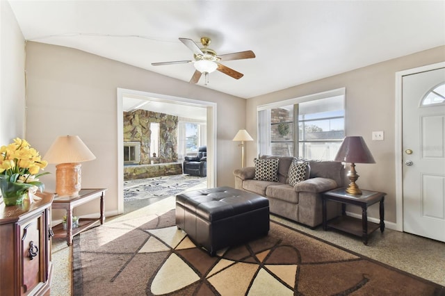 living room featuring lofted ceiling and ceiling fan